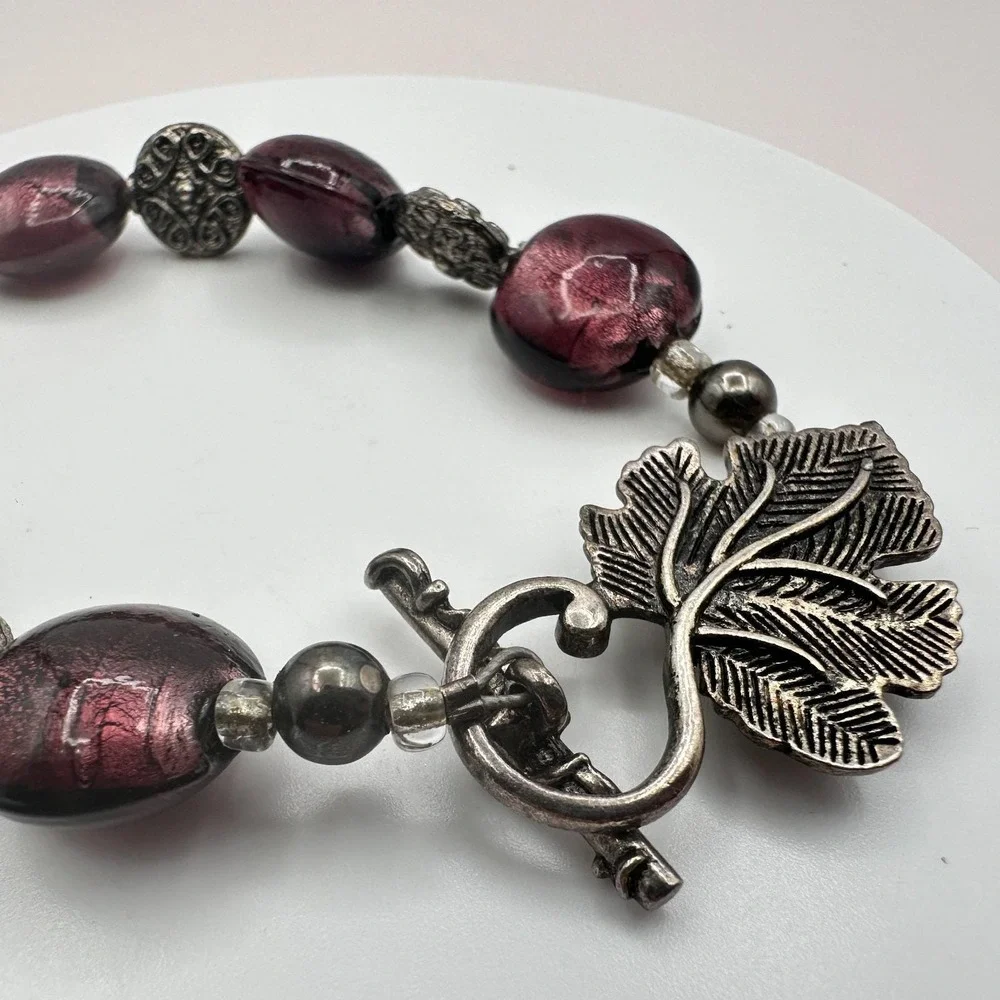Vintage 90s Silver Tone Leaf Cross Charm Purple Foil‎ Glass Bead Toggle Bracelet